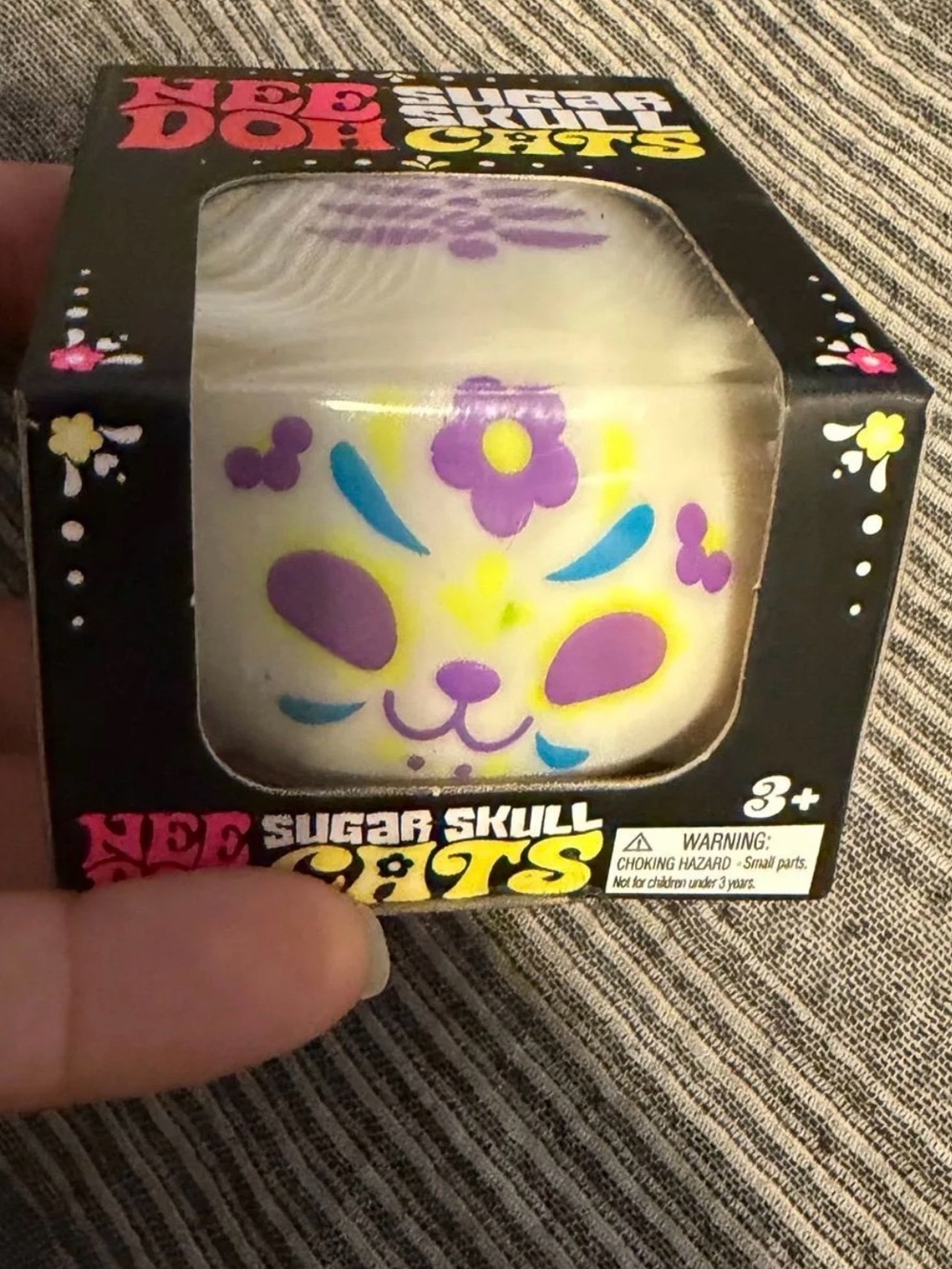 Purple needoh skull cat